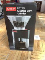 Front view of the Bodum Bistro electric burr grinder box featuring the product image and brand name.