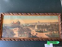 Full view of the framed panoramic print showing the public garden and the domed casino building with palm trees and landscaped gardens.
