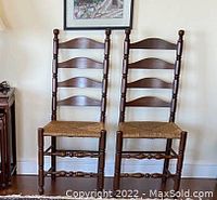 Pair of cherry wood Pennsylvania House ladderback chairs side by side, showing overall condition and style.