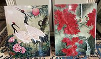 Photo showing two 11x14 prints side by side; the left features Paradise Cranes, right features Longevity with red flowers and birds.