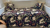 Floral fabric daybed duvet fully spread on daybed with coordinating pillows displayed
