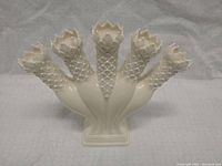 Front view of the creamware tulip vase showing all five finger sections and detailed leaf pattern.