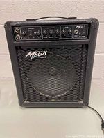 Front view of the Mega Amp GL30R amplifier showing control panel, brand logo, and speaker grille.
