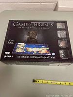 Box of the Game of Thrones 4D Puzzle showing the map of Westeros and Essos and dimensions of the puzzle.