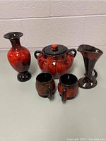 Primary photo showing all five pottery pieces on a white surface