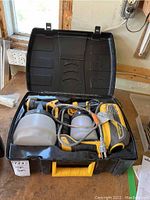 Overview of Wagner Flexio sprayer kit in carrying case showing sprayer body and cups