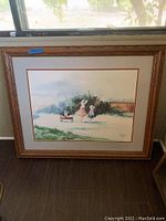 Framed watercolor print depicting children outdoors, framed in carved wood with double matting.