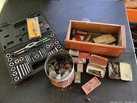 Full lot overview showing coffee can with lead sinkers, wooden box with various tools, and multiple small boxes and containers.