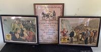 Three framed items against a wall: two vintage movie lobby cards and one decorative sampler in the center. Glass on one lobby card frame is broken.