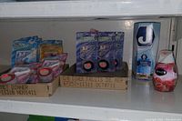 Photo of bathroom cleaning items including toilet bowl cleaner tablets, J-Cloth cleaning cloths, and a Muzzi air freshener
