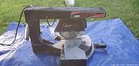 Side view of the 7 1/2 inch Craftsman radial arm miter saw showing the motor, base and arm.