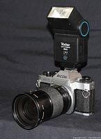 Ricoh KR-10 SE camera with Vivitar 2800 flash attached and 28-85mm lens mounted.
