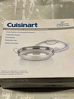 Front of box showing brand, product, and features including classic stainless steel, comfortable handles, even heating, dishwasher safe, lifetime warranty.