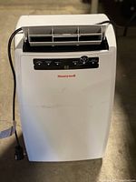 Front view of Honeywell portable air conditioner showing digital control panel and air vent.