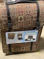 Front view of the tapestry fabric sewing case and tote set with the product tag showing usage examples.