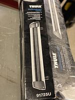 Box of Thule 91725U Ski/Snowboard Carrier showing product image and part number