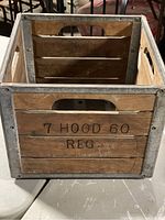 Front view showing wooden slats with stamped text 7 HOOD 60 REG and metal reinforcements.