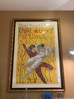 Full view of framed poster hanging on wall