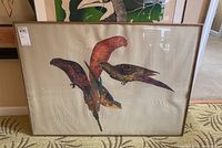 Framed artwork showing four stylized multicolored birds on a textured background, signed and numbered by Jonna White in 1980.