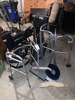 Full assortment of walkers, wheelchairs, cushions and accessories in garage setting