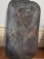 Underside of cast iron griddle showing Findlay branding and support ribs.