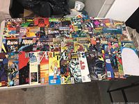 Photo showing a variety of vintage comic books laid out on a table.