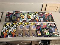 Top-down view of 17 DC Robin comic books displayed on a table