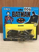Front view of Ertl Batmobile in original packaging with Batman and Joker artwork.