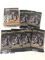 Harley Davidson Factory Set box and seven sealed booster packs displayed together.