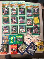 Full overview of all loose and packaged baseball cards displayed on table.