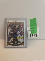 Photo of Alex Chiasson signed hockey card featuring him in Ottawa Senators uniform number 90, protected in plastic sleeve.