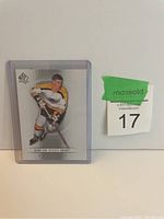 Front image of Bobby Orr hockey card in protective sleeve with MaxSold auction lot sticker visible.