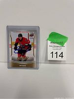 Front view of Bobby Ryan autograph hockey card in protective case with lot tag visible