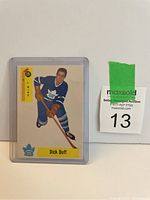 Photo of Dick Duff Toronto Maple Leafs hockey card in plastic sleeve with MaxSold auction tag