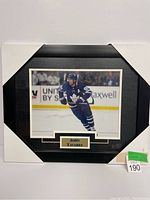 Photo of the framed 8x10 picture of John Tavares in Toronto Maple Leafs uniform with nameplate.