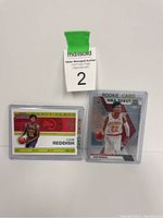 Lot of 2 Cam Reddish rookie basketball cards laid out showing front designs.