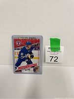 Mitch Marner rookie card #5 in a protective sleeve with clear white background and green MaxSold auction tag.
