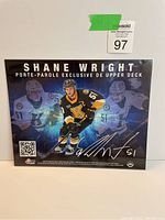 Photo of the limited edition Upper Deck exclusive print of Shane Wright, numbered 8/10, showing the player in a Kingston Frontenacs hockey jersey with autograph and dynamic background images.