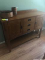 Front angle view of oak sideboard
