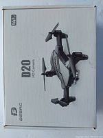 Front of the DEERC D20 drone box showing foldable drone image and HD camera model name.