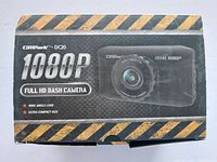 Front box displaying product image and key features including 1080P resolution, full HD, wide angle lens, and ultra compact size.