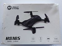 Box of Holy Stone HS165 drone showing drone image and key features: HD camera, GPS, FPV, 2.4GHz band