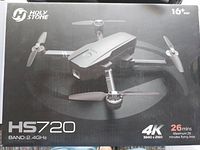 Closed retail box showing HolyStone HS720 branding, 4K camera spec and 26 min flight time