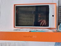 Front view of MatrixPad Z10 tablet in its box showing tablet screen and front camera.