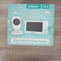 Front view of Campark BM40 Wireless Baby Monitor box showing camera and monitor images.