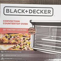 Photo of box front showing Black+Decker convection countertop oven, highlighting 20% faster cooking, fits 12-inch pizza or 6 slices of toast, convection technology, 60-minute timer with stay on function.