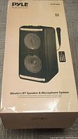 Box of the Pyle PPHP288B wireless BT speaker system showing image of speaker and microphone with key features listed on front.