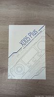 Front of the sealed XD05 Plus packaging showing the product name and branding with a line drawing of the device.