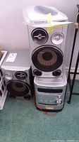 Full view of Sony HPD-HPZ9 stereo system showing main unit and two speakers on floor carpet.