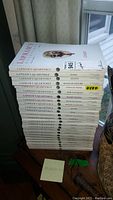 Stack of 25 Lapham's Quarterly magazines with visible titles and wear marks on some covers.
